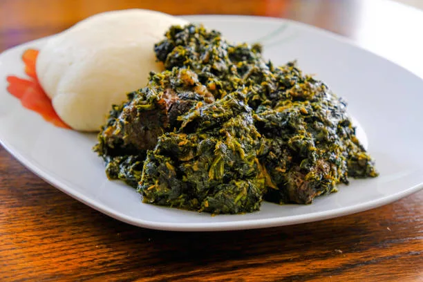 Nigerian Pounded yam served with Afang vegetable Soup