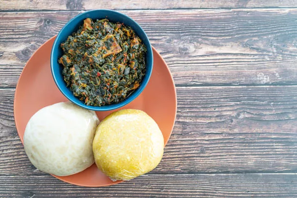 Garri and Pounded Yam with Efo Riro Vegetable Soup