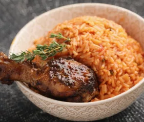 Nigerian Jollof Rice with roasted chicken thigh and thyme